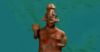 A ceramic figure holding a cup.